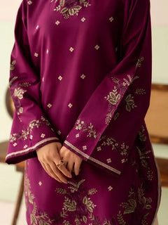 Close-up of floral embroidery on the plum Dhanak dress sleeves and hem