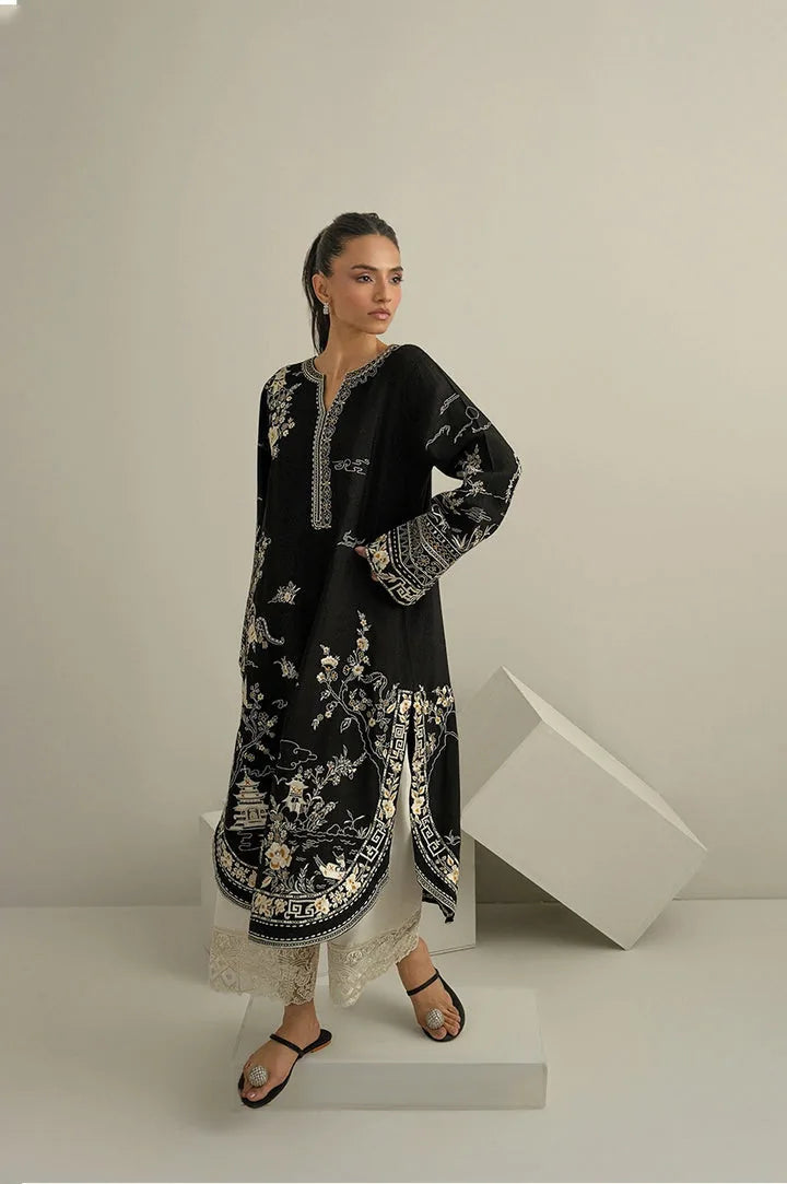 Black Dhanak unstitched 3-piece dress with ivory floral embroidery and ivory trousers, angled view