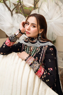 Close-up of pink and ivory floral embroidery on the black Dhanak shirt sleeves and matching dupatta