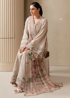 Clay beige Dhanak unstitched dress shown styled with a pink floral dupatta, seated view