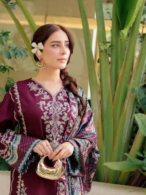 Close-up of beige floral neckline and sleeve embroidery on plum Dhanak dress