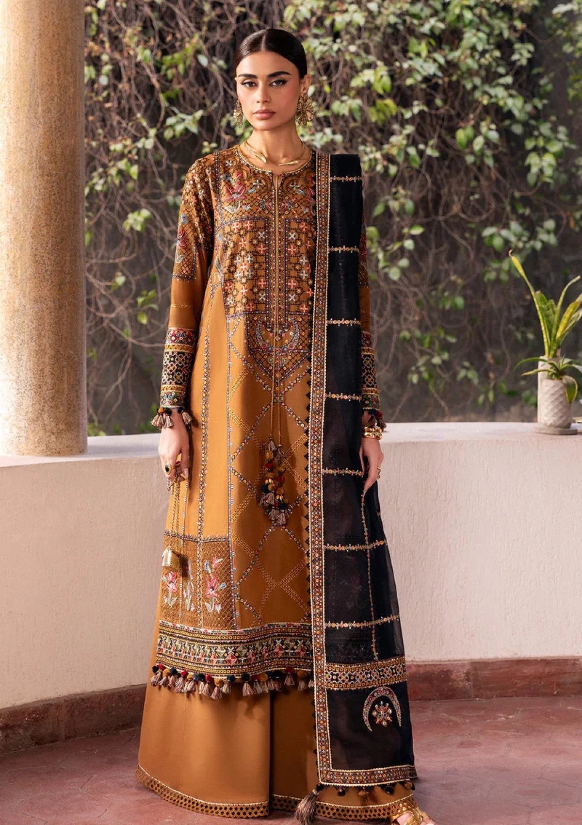 Mustard Dhanak unstitched 3-piece dress with embroidered shirt and black Pashmina shawl, front view