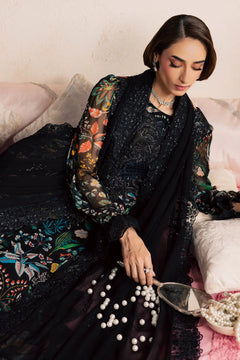 Black Khadar 3-piece unstitched dress with floral print and embroidered front panel, seated detail view