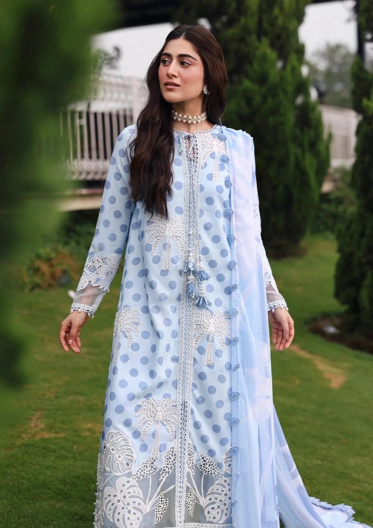 White floral embroidery on light blue patterned Khadar unstitched dress with coordinating dupatta