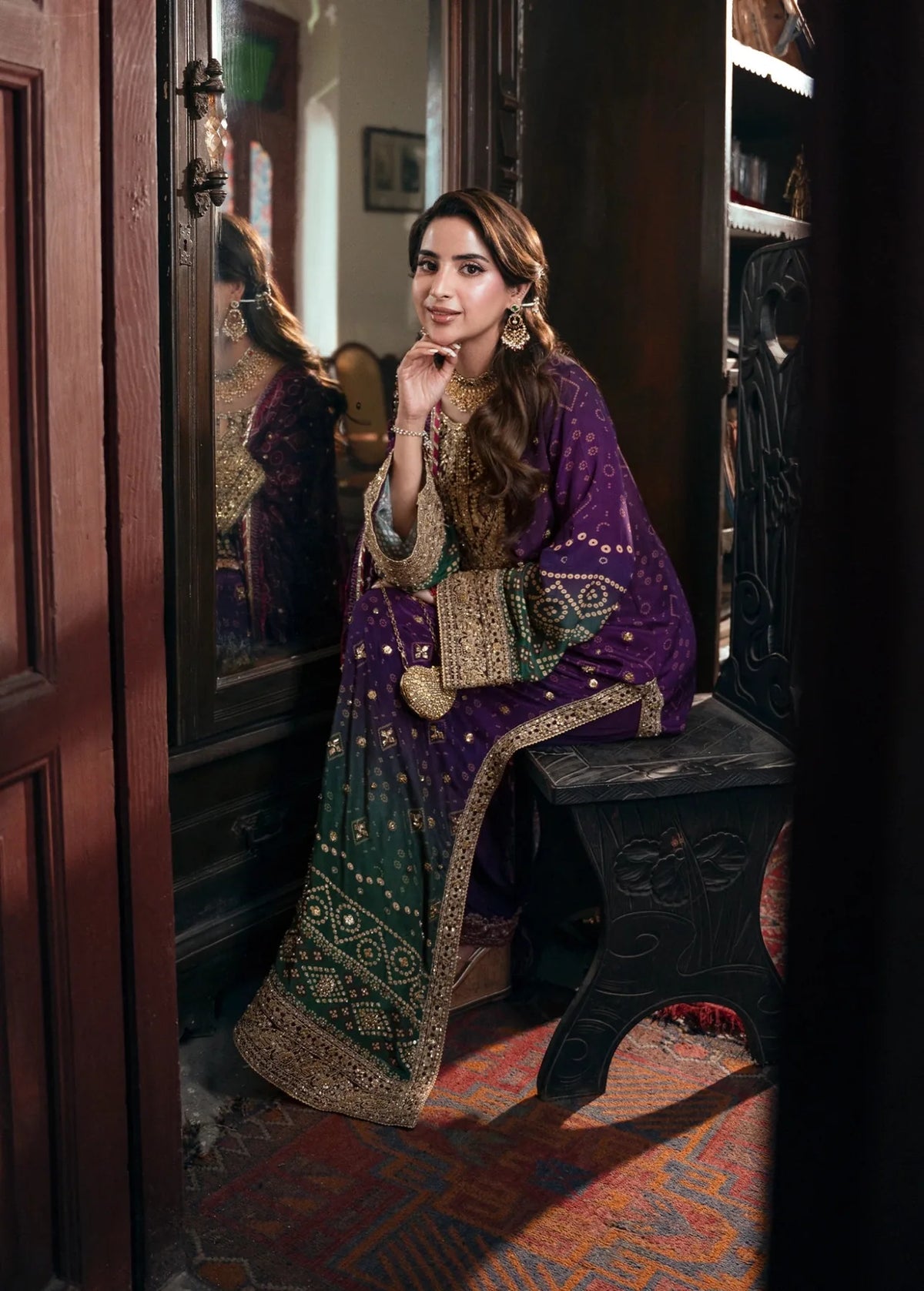 Purple and green Khadar 3-piece unstitched dress with patterned borders, seated styling view
